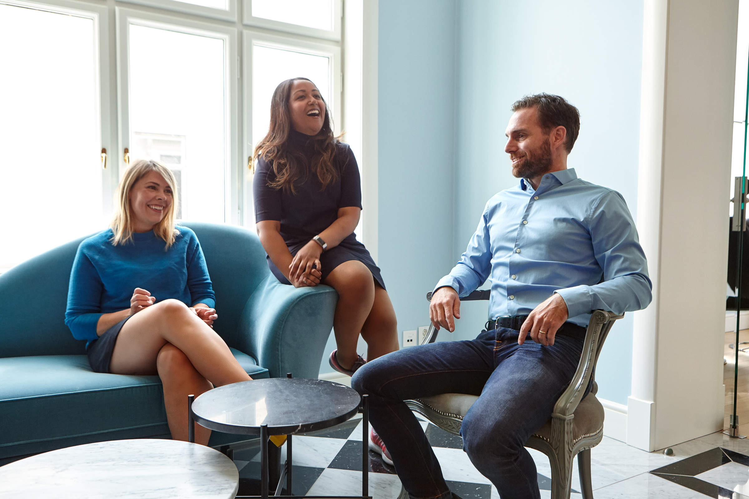 Three colleagues having a chat in the sofa